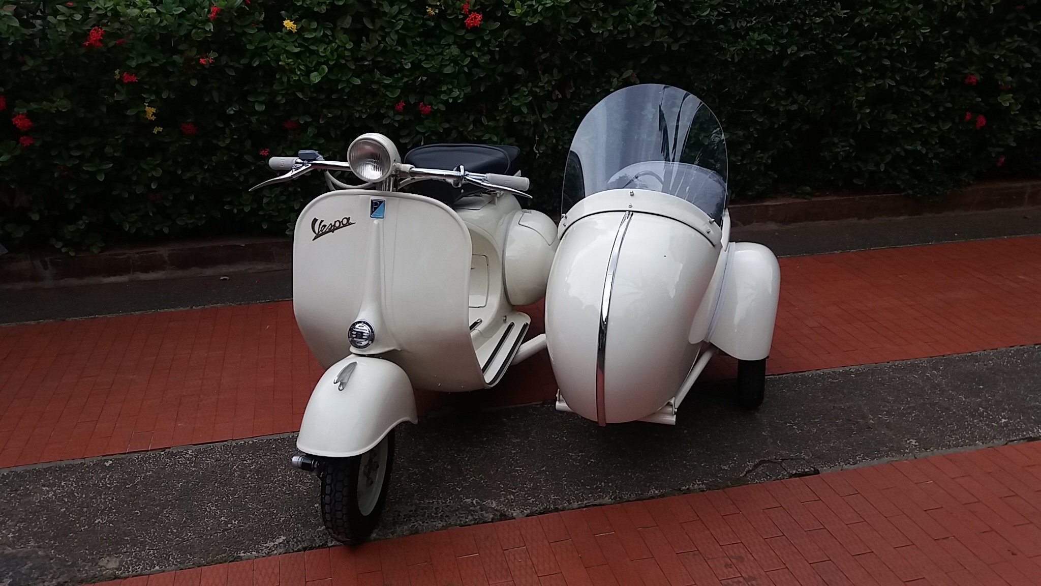 Handmade sidecar seat and carpeted interior on Vespa Struzzo